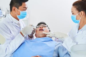 two-asian-dentists-working-AP6SKMF